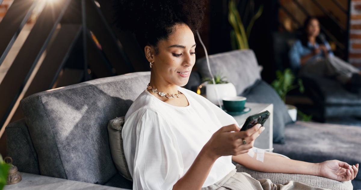 Woman, relax and iv infusion with phone for communication, minerals and browsing website